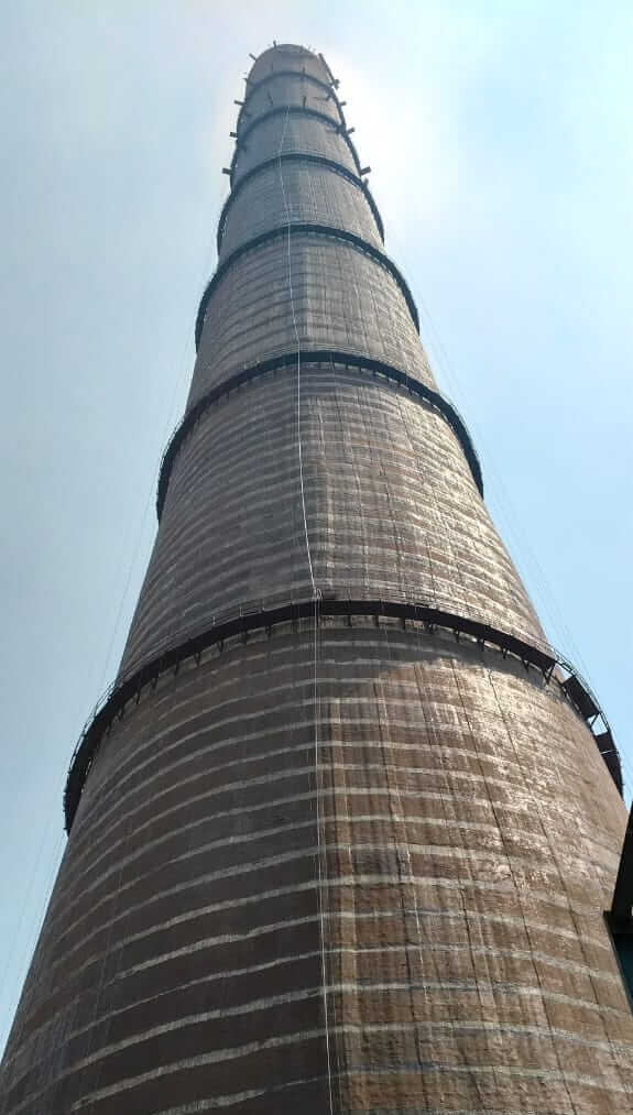 Industrial chimney repair work with structural rehabilitation and safety inspectiony Repair